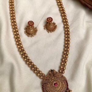 Antique gold finish temple jewellery long necklace with intricate pendant, red and green kemp-style stones, bead detailing and matching earrings | Code MNK 44